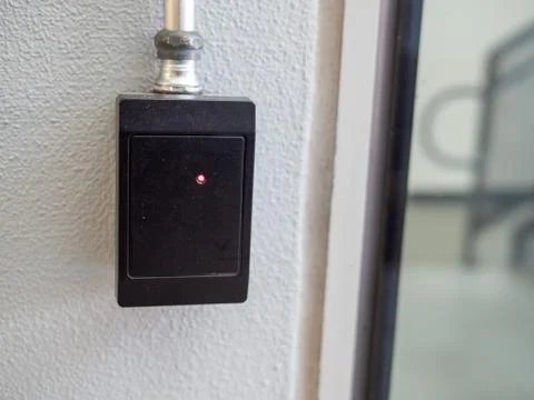 Black electronic keycard reader scanner outside of building entrance Stock Photos