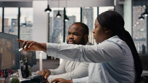 Black employees team using architectural CAD software for modern layout design Stock Photos