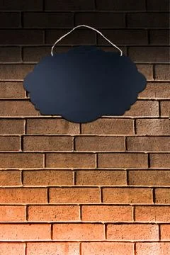 Black Empty Sign Board on brick background Stock Photos