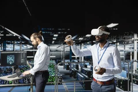 Black engineer analyzing performance checkup using virtual reality tech Stockfoto's