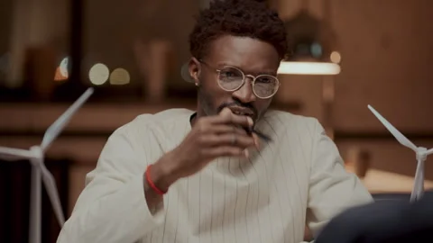 Black Engineer Explaining Ideas for Renewable Energy Project to Colleague Stock Footage 300230760