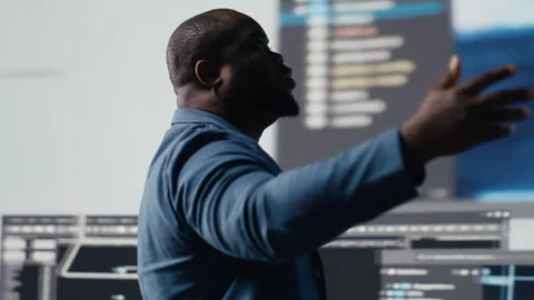 Black engineer explores algorithm design and binary code with AI tools Stock Footage 312413879