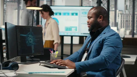 Black engineer uses artificial intelligence systems for data mining Stock Footage 313963455