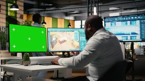 Black engineer works on floor plan design with a mockup display Stock Footage 316795295