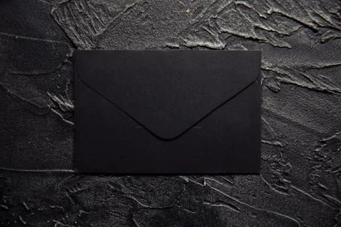 Black envelope on a dark background Stock Photos