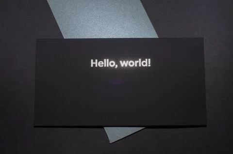 Black envelope on top, on gray envelopes on the bottom, on a dark flat back.. Stock Photos