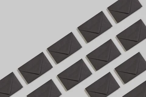 Black envelopes on a gray background with copy space Stock Photos