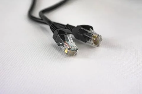 Black ethernet network cable for connections between computers and routers Stock Photos