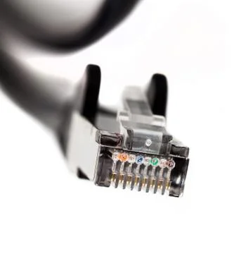 Black ethernet patch cable end connector plug macro, closeup. Rj 45, 8p8c Stock Photos