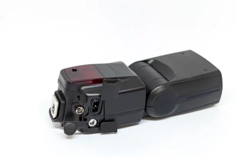 Black external flash for a camera with open additional connectors Stock Photos