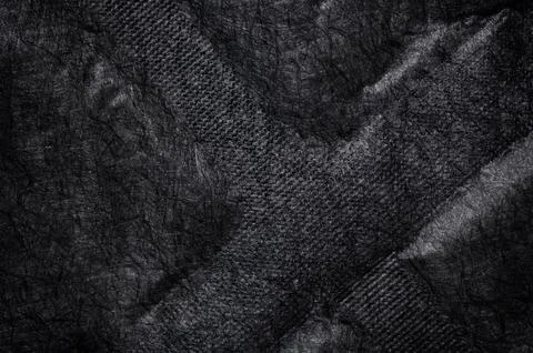 Black fabric canvas silk texture background. Abstract closeup detail of tex.. Stock Photos