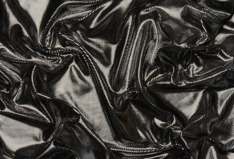 Black fabric with foil elements, wavy surface 스톡 사진