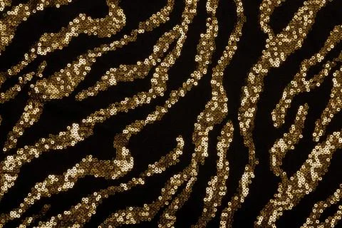 Black fabric with golden sequin pattern Stock Photos