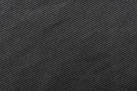 Black fabric. Material for tailoring. Pattern with straight small dark lines Stock Photos