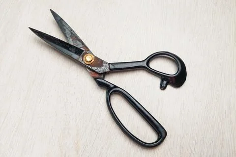 Black fabric scissors on a white background. Stock Photos