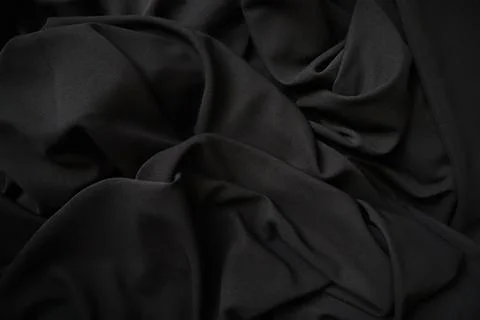 Black fabric texture background. Drapery wallpaper Stock Photos