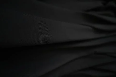 Black fabric texture background. Drapery wallpaper Stock Photos