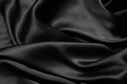 Black fabric texture background, wavy fabric slippery black color Stock Photos