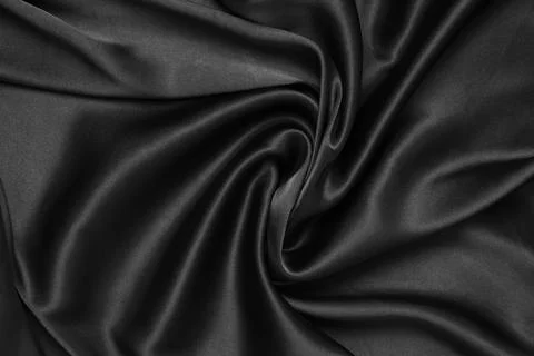 Black fabric texture background, wavy fabric slippery black color Stock Photos