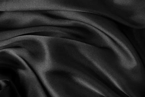 Black fabric texture background, wavy fabric slippery black color, luxury s.. Stock Photos