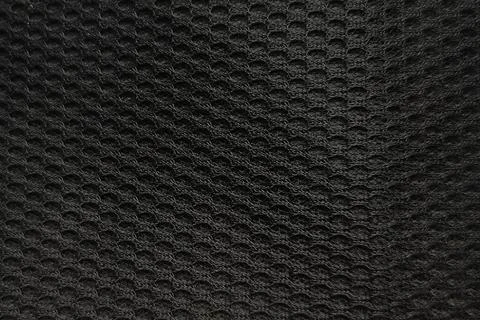 Black fabric texture with mesh pattern close up background Stock Photos