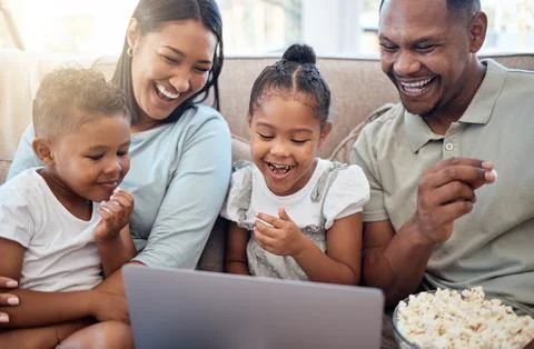 Black family, laptop and sofa for movie, popcorn and streaming on internet in Stock Photos