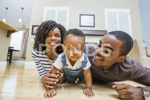 Black Family Playing On Living Room Floor