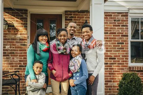 Black Family Smiling Outside House