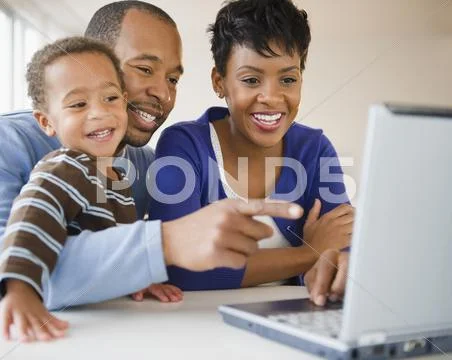 Black Family Using Laptop Together