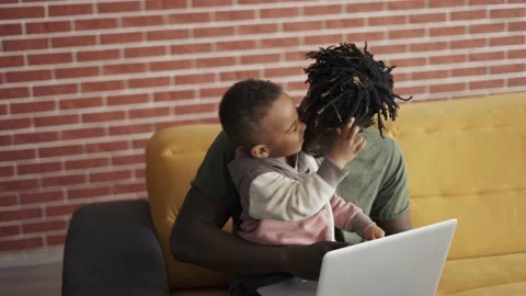 Black father and small boy learning computer at home for child education Stock Footage 154232148
