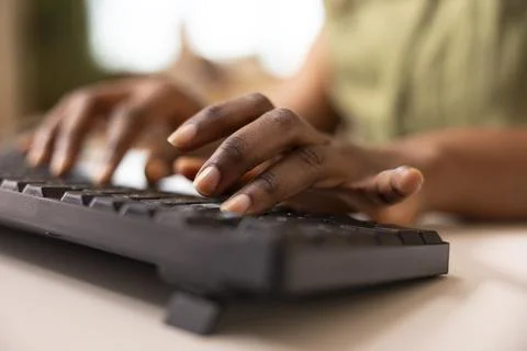 Black female hands typing on computer keyboard Stock Photos