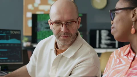 Black Female Programmer Discussing New Software with Male Colleague Stock Footage 306847616