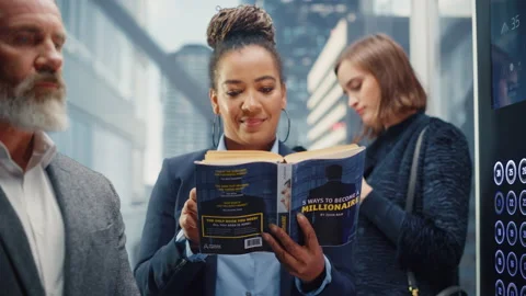 Black Female Riding Elevator Reading Book 스톡 동영상 167836295