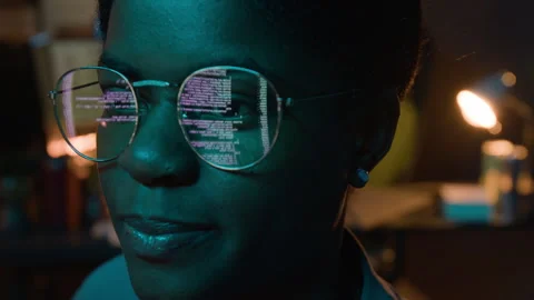 Black Female Software Developer Coding with Screen Reflection in Glasses Stock Footage 336709983