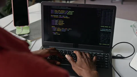 Black Female Software Developer Typing Code on Laptop Computer Stock Footage 336708332