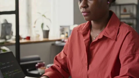 Black Female Software Developer Typing on Laptop with Focus Stock Footage 336709024
