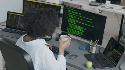 Black Female Software Engineer Typing Code on Computer Stock Footage 276202262
