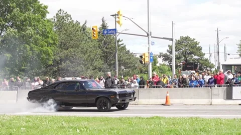 Black Ferrari drifting racing during annual Ottawa Ferrari festival Stock Footage 201092533