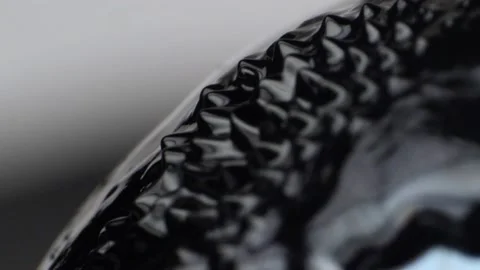 Black ferrofluid moves onto the surface of a magnetic ball Stock Footage 147356209