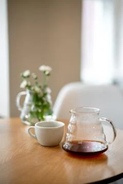Black filter coffee on the table in cafe service kettle hario pour over cup Stock Photos
