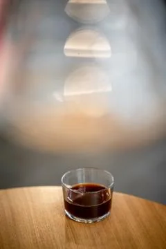 Black filter coffee on the table in cafe glass cup hario pour over cup Foto stock