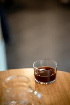 Black filter coffee on the table in cafe glass cup hario pour over cup Foto stock