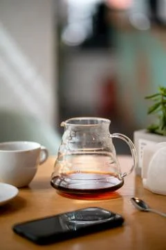 Black filter coffee on the table in cafe service kettle hario pour over cup Stock-Fotos