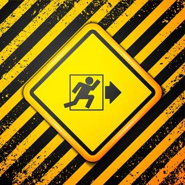 Black Fire exit icon isolated on yellow background. Fire emergency icon. Wa.. Ilustración de archivo