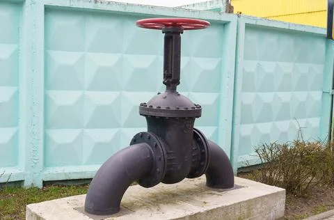 Black Fire Hydrant on Cement Block Stock Photos
