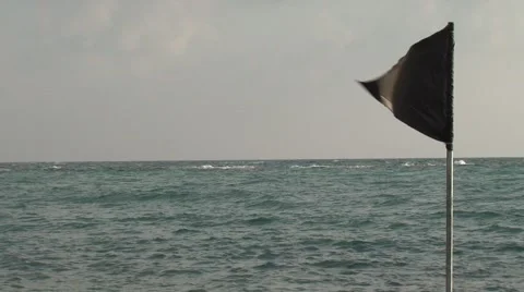 Black flag on the sea Stock Footage 45490861