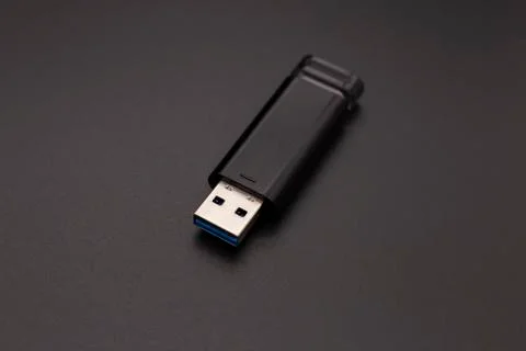 Black flash drive on a dark background Stock Photos