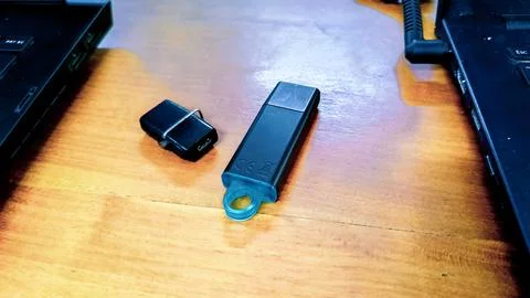 Black Flashdrives placed on a table Stock Photos