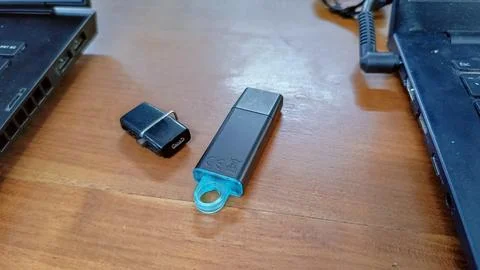 Black Flashdrives placed on a table Stock Photos