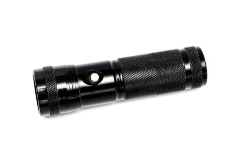 Black flashlight with button, isolate on white background Stock Photos